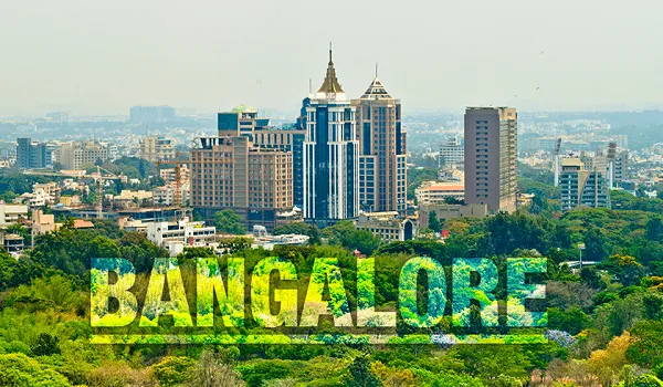 Bangalore – city context for Prestige Airport Road buyers Bengaluru city skyline with high-rise buildings and green tree cover